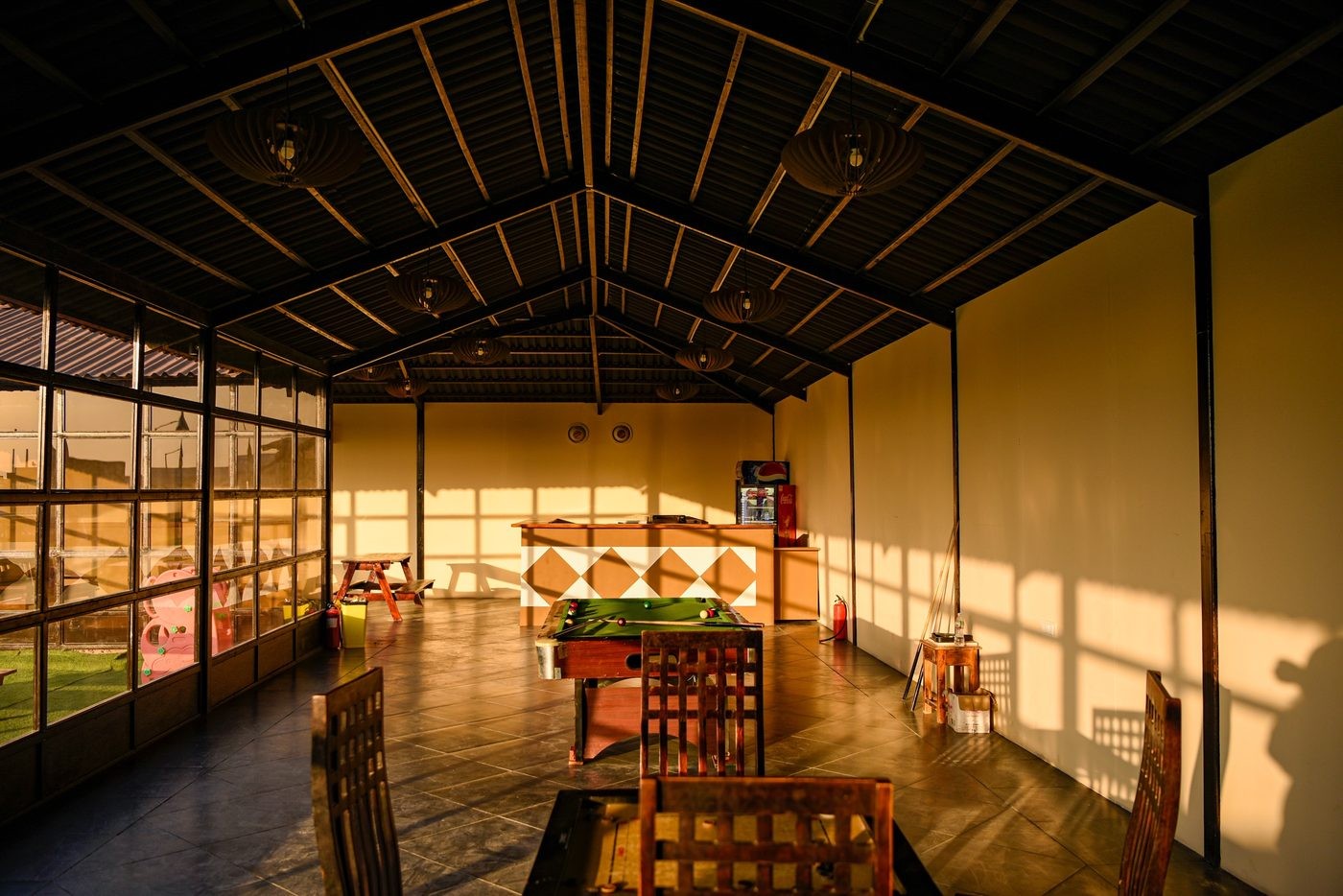 Indoor games lounge with pool table, carrom board and children’s play area at Rann Utsav tent city